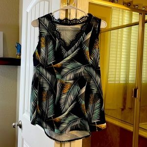 Sleeveless blouse, multi print size large, tags have been removed